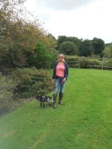 sue and dog 225x300 - With dog - Shared Lives South West Carer Sue